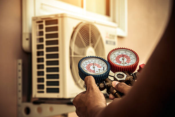Professional Air Conditioning Service technician working in Keene, TX
